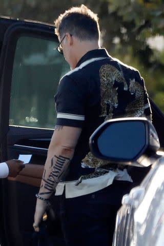 <p> MEGA</p> Joe Manganiello shows off his new tattoo while out in Brentwood, California