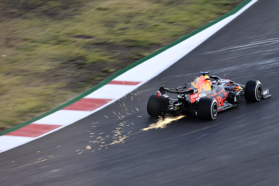 Sparks fly behind Max Verstappen driving the (33) Aston Martin Red Bull Racing RB16 during practice ahead of the F1 Grand Prix of Portugal.