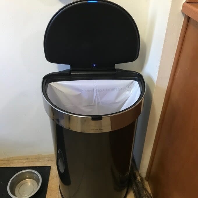 a reviewer photo of the trash can in black