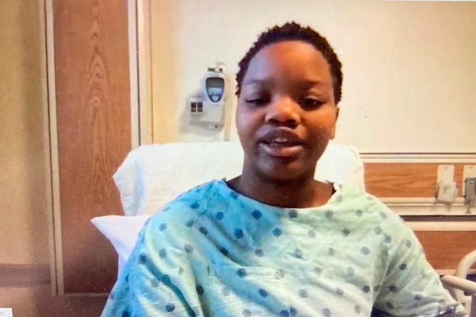 n this image taken from a video screen, Tafara Williams speaks to reporters from her hospital bed during a Zoom meeting Tuesday, Oct. 27, 2020 in Libertyville, Ill.