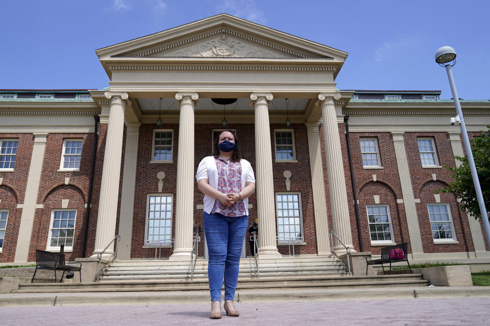 Dr. Michelle LaRue wears a face mask as she stands for a portrait in Hyattsville, Md., on Wednesday, Aug. 12, 2019. LaRue is a manager at CASA de Maryland, an immigration advocacy group that has partnered with health officials in Prince George's County just outside of Washington. D.C., to make the calls to Spanish speakers. She said earning trust begins with hiring contact tracers who not only speak Spanish but also intimately understand immigrant communities. (AP Photo/Julio Cortez)