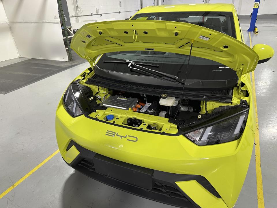 The battery of a BYD Seagull electric vehicle is shown under the hood of the car at the Caresoft Global facility Wednesday, April 3, 2024, in Livonia, Mich. Caresoft President Terry Woychowski, a former engineer at General Motors, said the Seagull represents a "clarion call" for the U.S. auto industry. (AP Photo/Mike Householder)