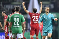 Bayern's goalkeeper Manuel Neuer, right, and Bayern's Thomas Mueller celebrate end of the German Bundesliga soccer match between Werder Bremen and Bayern Munich in Bremen, Germany, Tuesday, June 16, 2020. Because of the coronavirus outbreak all soccer matches of the German Bundesliga take place without spectators. Bayern Munich secured its eighth successive German Bundesliga title Tuesday with two games to spare after beating Werder Bremen 1-0 with a goal from Robert Lewandowski. (AP Photo/Martin Meissner, Pool)