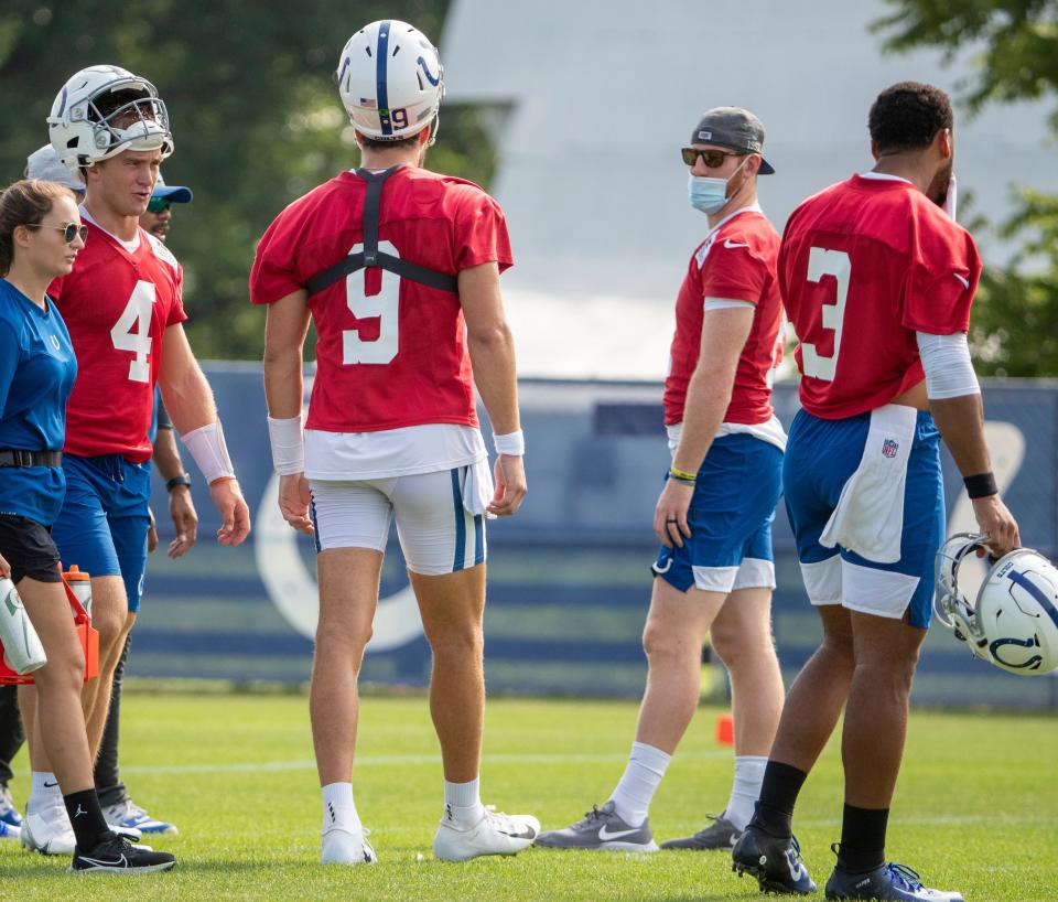 Indianapolis Colts quarterback Carson Wentz (second from right) with other quarterbacks at Grand Park in Westfield on Monday, August 10, 2021, on the third week of workouts of this summer's Colts training camp.