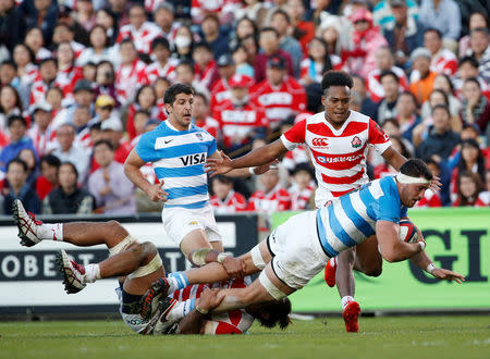 Rugby Union - Rugby Test -Japan v Argentina - Prince Chichibu Memorial Stadium, Tokyo, Japan - 05/11/16 Argentina's Javier Ortega Desio (R) is tackled by Japan' Amanaki Lelei Mafi. REUTERS/Kim Kyung-Hoon