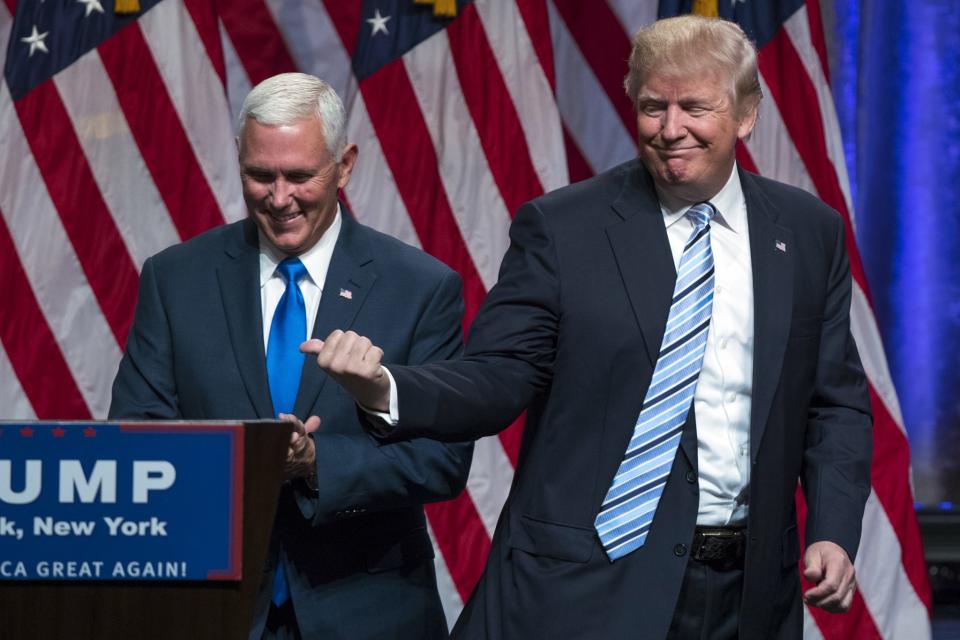 Donald Trump, right, introduces Gov. Mike Pence, R-Ind., during a campaign event to announce Pence as the vice presidential running mate on, Saturday, July 16, 2016, in New York.(Photo: Evan Vucci/AP)