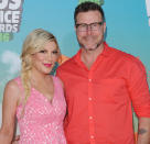 <p>About seven years into their marriage, Dean cheated on the <em>Beverly Hills, 90210</em> star while he was in Toronto. The pair — who have five children together — entered intense personal and couples therapy and stuck it out. Of her decision to stay with her husband, <a rel="nofollow noopener" href="http://people.com/tv/tori-spelling-dean-mcdermott-talk-saving-marriage-after-infidelity/" target="_blank" data-ylk="slk:Spelling told People;elm:context_link;itc:0;sec:content-canvas" class="link ">Spelling told <em>People</em></a>, “we made the conscious decision based on our love for each other to tough it out and work through it.” She added, “It was one of the worst times in our lives, but it was also one of the best times. I wouldn’t change anything because if we hadn’t started talking and opened up those lines of communication, maybe we wouldn’t be here today.” (Photo: Axelle/Bauer-Griffin/FilmMagic) </p>