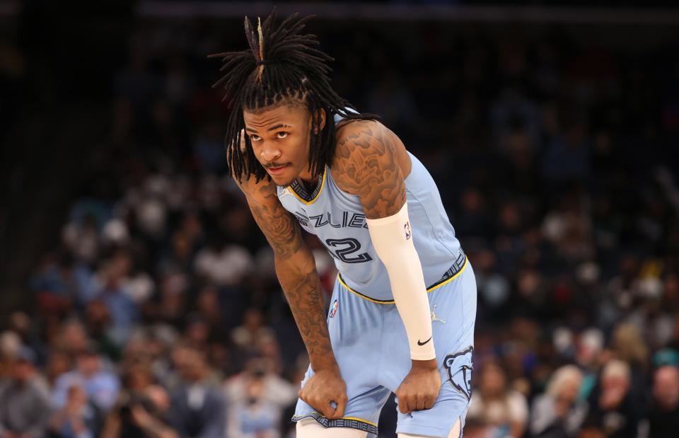 Memphis Grizzlies guard Ja Morant takes a breather during a pause in their game against the Los Angeles Clippers at FedExForum on Tuesday, Feb. 8, 2022.