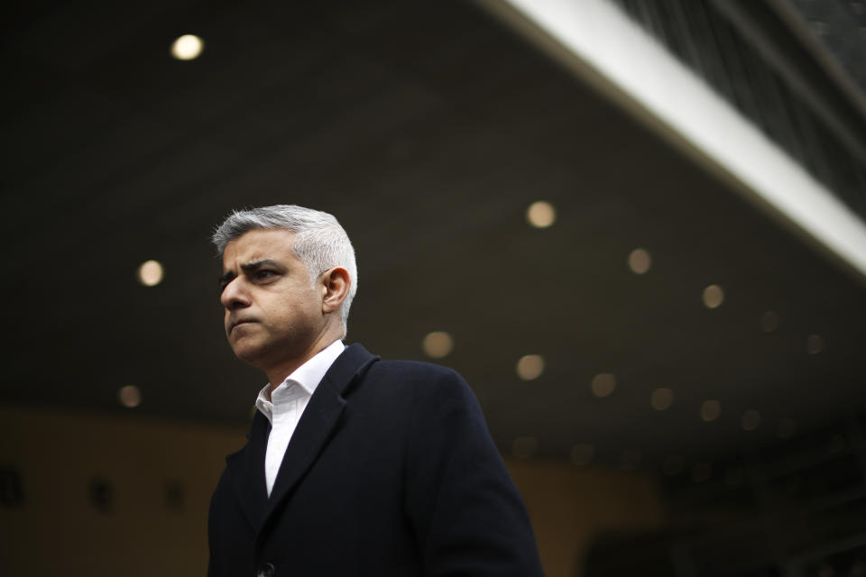 FILE - In this Tuesday, Feb. 18, 2020 file photo London Mayor Sadiq Khan talks to journalists following his meeting with European Commission's Head of Task Force for Relations with the United Kingdom Michel Barnier at the EU headquarters in Brussels. On May 6, Londoners will elect a mayor, whose performance will help determine whether this is the start of a period of decline for Europe's biggest city — or a chance to do things better. Current Mayor Sadiq Khan, who is favored to win re-election, says his top priority is preserving jobs threatened by the economic blow of the pandemic. (AP Photo/Francisco Seco, File)