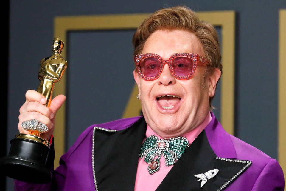 Elton John poses with the Oscar for Best Original Song for 