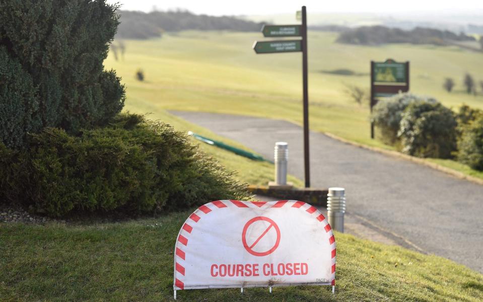 A "COURSE CLOSED" sign is pictured at Dyke Golf Club, north of Brighton, in southern England - GETTY IMAGES
