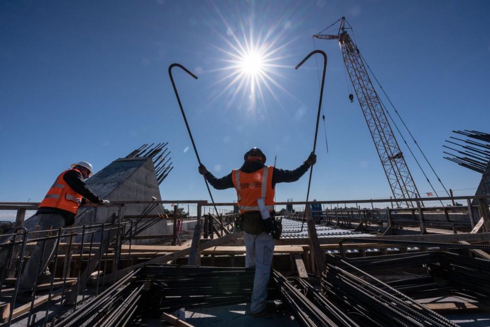 Laborers work on the state's high-speed rail project.