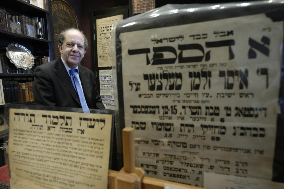 Professor David Latchman with items in his collection of memorabilia related to the history of British Jews, in London, Friday, April 28, 2023. At a time when religion is fueling tensions around the world from Hindu nationalists in India to Jewish settlers in the West Bank and fundamentalist Christians in the United States, King Charles III is trying to bridge the differences between the faith groups that make up Britain’s increasingly diverse society. (AP Photo/Kirsty Wigglesworth)