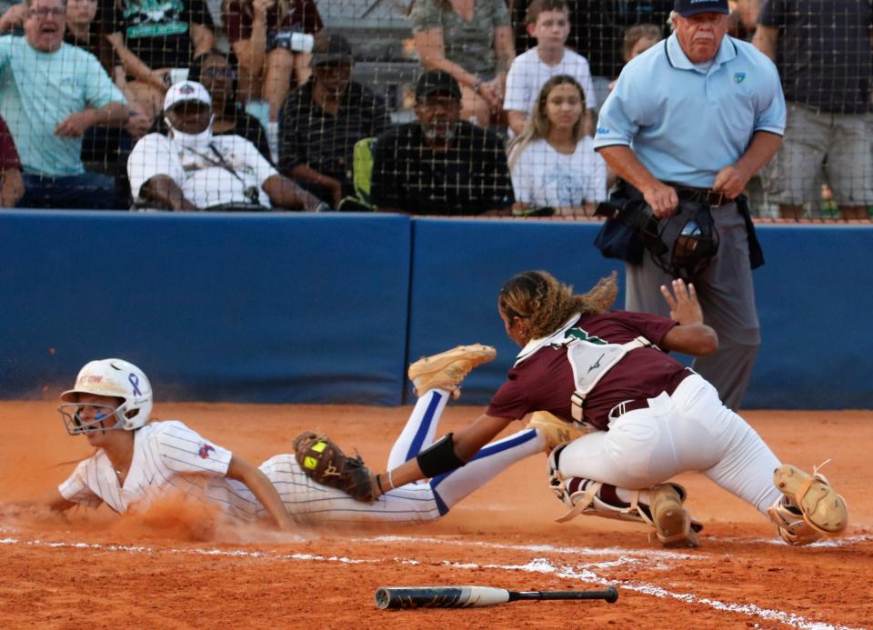 Bartow's Alyssa Hillman slides in ahead of the tag from George Jenkins' Olivia Newman during Thursday's district softball final. The Yellow Jackets took a 5-1 victory.