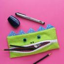 <p>They call this "The Gobbler" for a reason — it eats up school supplies. (And it keeps them neatly organized.)</p><p><em><a href="https://www.shinyhappyworld.com/2014/09/free-pattern-gobbler-pencil-eating-monster-back-school.html" rel="nofollow noopener" target="_blank" data-ylk="slk:Get the tutorial at Shiny Happy World »;elm:context_link;itc:0;sec:content-canvas" class="link ">Get the tutorial at Shiny Happy World »</a></em></p>