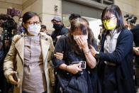 Supporter of pro-democracy activists cries after court grants bail to 15 of 47 democracy activists charged with subversion over national security law at West Kowloon Magistrates' Courts, in Hong Kong