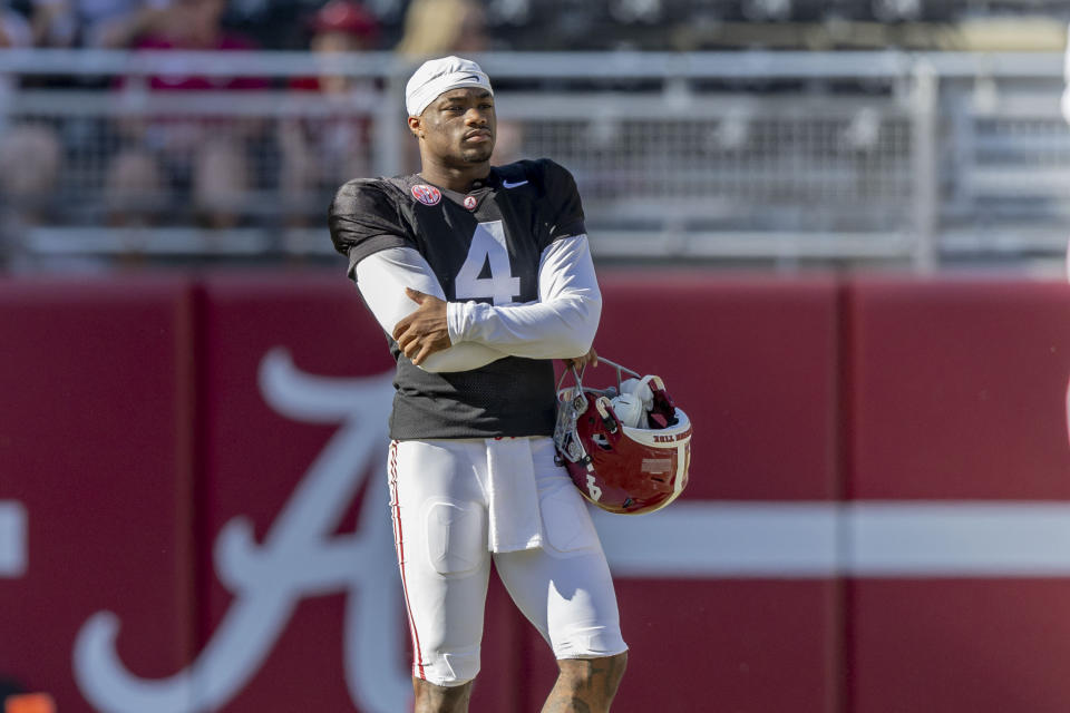 Alabama quarterback Jalen Milroe (4) watches from the edge of the field during the team's A-Day NCAA college football scrimmage Saturday, April 13, 2024, in Tuscaloosa, Ala. (AP Photo/Vasha Hunt)