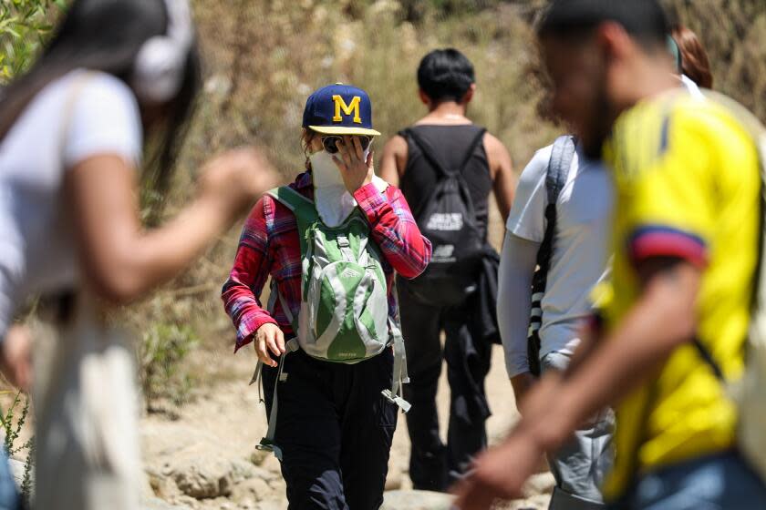 Pasadena, CA, Wednesday, July 3, 2024 - Nguyen Pham braves high temperatures while hiking the Eaton Canyon Trail. (Robert Gauthier/Los Angeles Times)