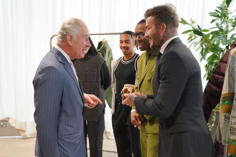King Charles III joking with David Beckham at a recent event