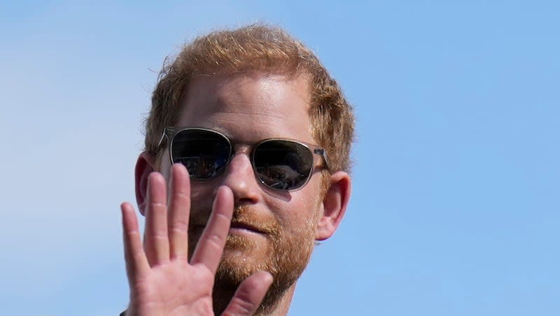 Britain's Prince Harry, the Duke of Sussex, waves during the Formula One U.S. Grand Prix auto race at Circuit of the Americas, on Oct. 22, 2023, in Austin, Texas. Prince Harry, the son of King Charles III and fifth in line to the British throne, has formally confirmed he is now a U.S. resident. Four years after Harry and his American wife, Meghan, decamped to a villa on the Southern California coast, a travel company he controls filed paperwork informing British authorities that he has moved and is now “usually resident” in the United States.