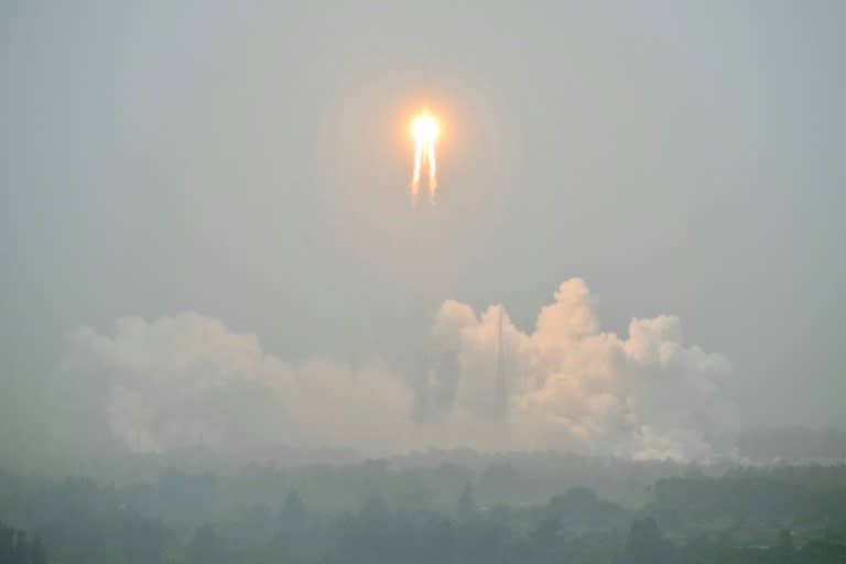 A Long March 5 rocket, carrying the Chang'e-6 mission lunar probe, lifts off at the Wenchang Space Launch Centre in southern China (HECTOR RETAMAL)