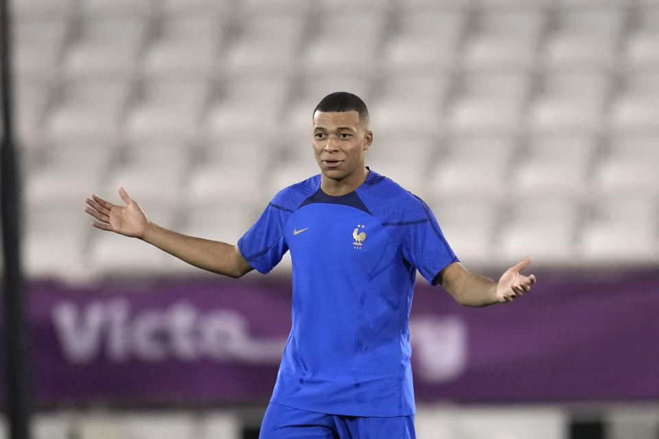 France's Kylian Mbappe gestures during a training session in Doha, Qatar, Tuesday, Dec. 13, 2022 on the eve of their World Cup semifinal soccer match against Morocco. (AP Photo/Christophe Ena)