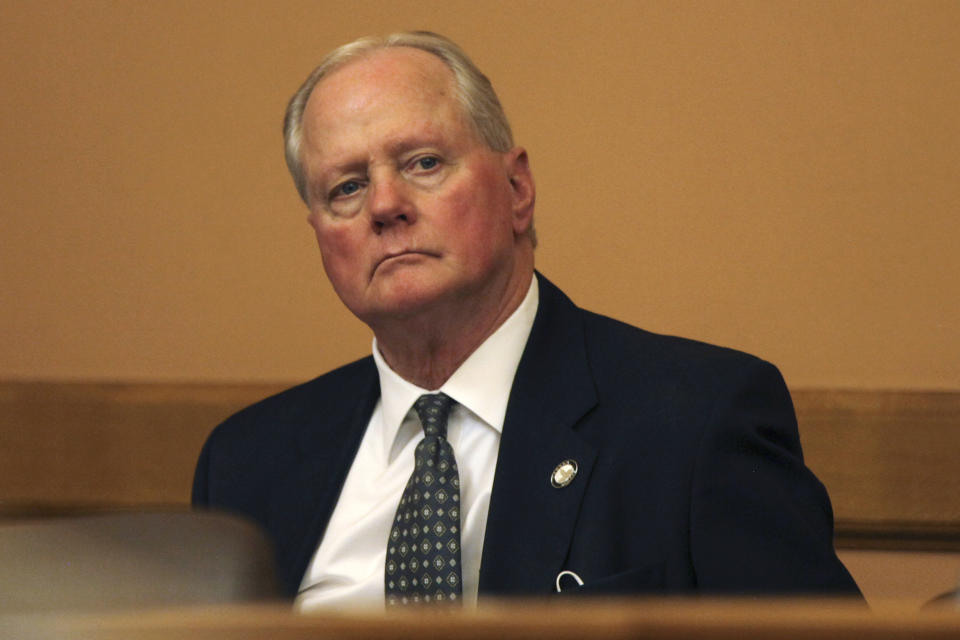 FILE - In this March 17, 2021 file photo, then, Kansas Senate Majority Leader Gene Suellentrop, R-Wichita, listens during a meeting of fellow GOP senators at the Statehouse in Topeka, Kan. Suellentrop appeared in a Topeka court Monday, Oct. 25, 2021 to formally accept a deal with prosecutors that dropped a felony charge of trying to elude law enforcement while speeding the wrong way on highways in Topeka. (AP Photo/Andy Tsubasa Field, File)