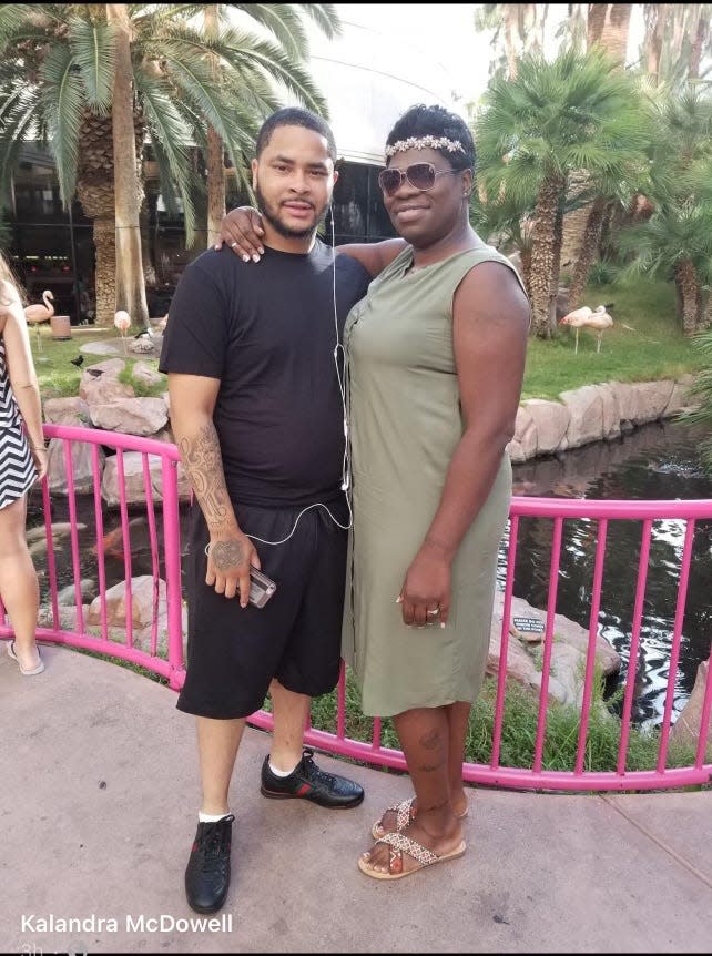 LaTeris Cook stands with his stepmother Kalandra McDowell. Cook, 27, was shot and killed on June 2 in an Akron mass shooting.