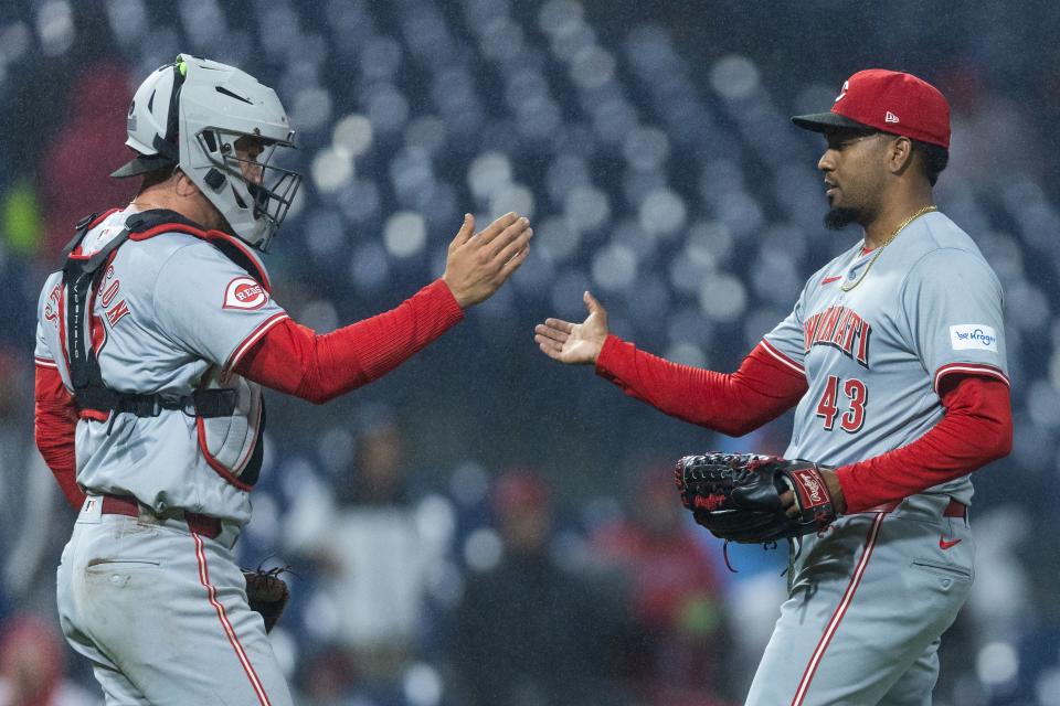 Alexis Diaz and Tyler Stephenson celebrate Wednesday night's 4-1 victory over the Philadelphia Phillies, giving the Reds a series victory. Diaz will be in the opposite dugout of his brother, Edwin, when the Reds and Mets begin a three-game series Friday.