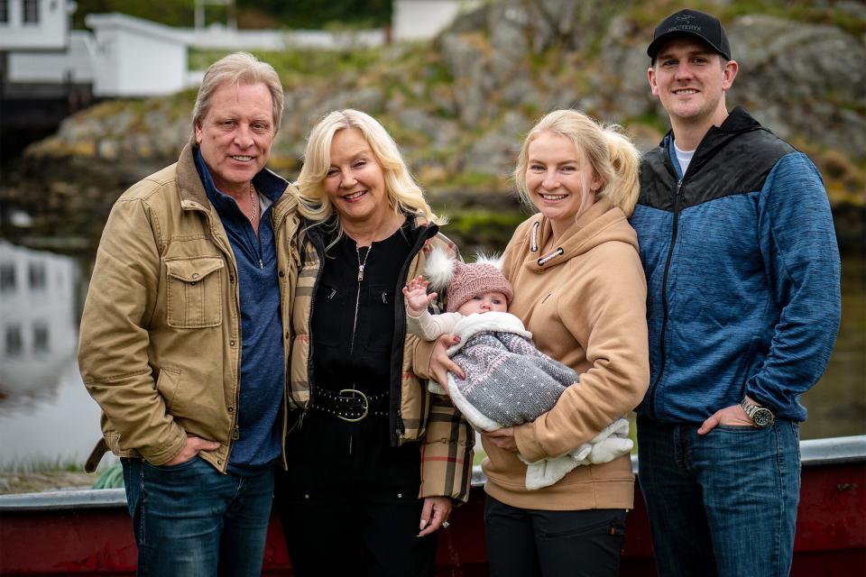 DEADLIEST CATCH: THE VIKING RETURNS Sig Hansen, June Hansen, Mandy Hansen holding baby, and Clark Pederson standing together.