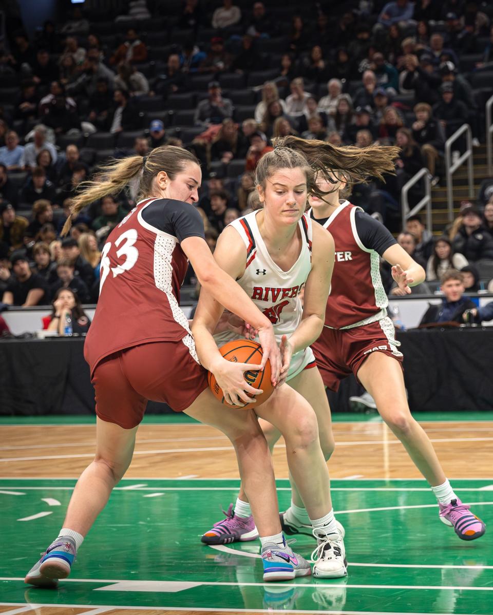 Worcester Academy's Ella Getz of Wayland, left, tries to strip the ball against the Rivers School at the TD Garden in Boston on Sunday.