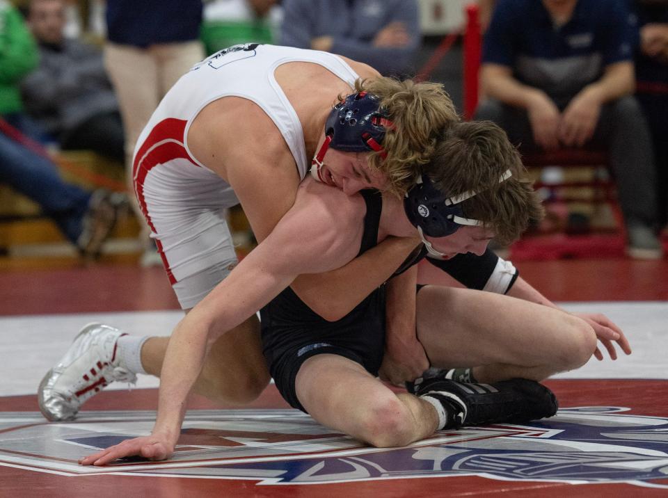 Manasquan's Michael O'Connor (right) became Manasquan's first district champion since 2004, when he won the District 22 138-pound title.