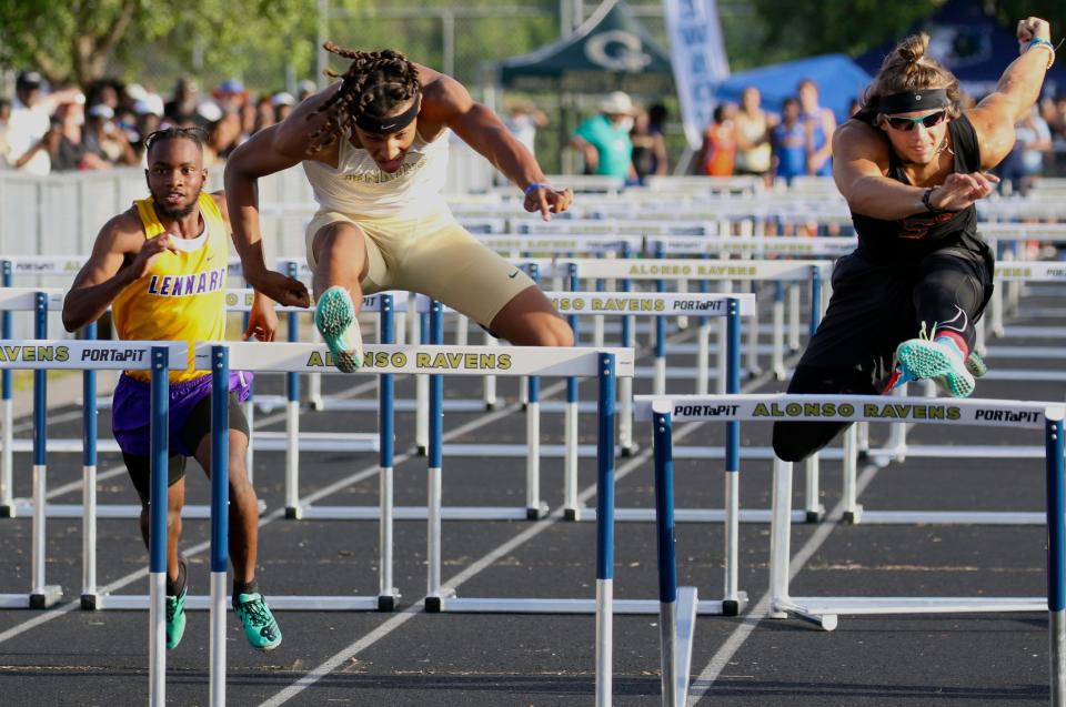 George Jenkins' Rey Hernandez clears the last hurdle  en route to winning the 110 hurdles on Saturday at the Class 4A, Region 2 track and field meet at Alonso High School in Tampa.