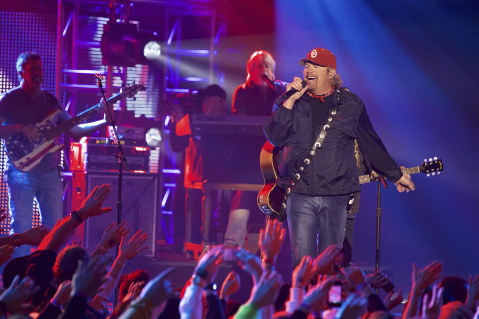 FILE - Toby Keith performs at the CMT Ultimate KickOff Party at Kay Bailey Hutchison Convention Center on Friday, Jan. 9, 2015, in Dallas. Keith, who died of cancer on Monday, Feb. 5, 2024, at age 62, is being celebrated for his immense catalog of songs. But his 2002 track “Courtesy Of The Red, White And Blue (The Angry American)" may be remembered most. (Photo by Ted Parker Jr./Invision/AP, File)