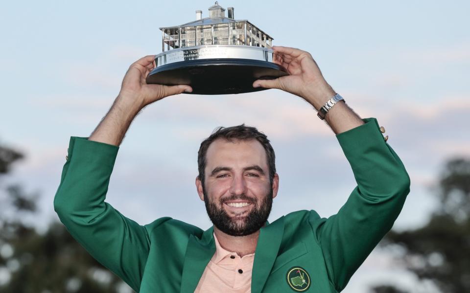 Scottie Scheffler holds Masters trophy