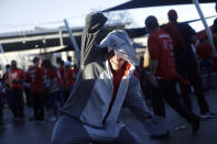 A Washington Nationals fan gestures the baby shark before Game 5 of the baseball World Series against the Houston Astros Sunday, Oct. 27, 2019, in Washington. (AP Photo/Pablo Martinez Monsivais)