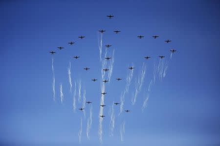 Airplanes form the symbol of the Workers' Party of Korea during the parade celebrating the 70th anniversary of its founding in Pyongyang October 10, 2015. REUTERS/Damir Sagolj