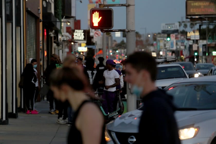 LOS ANGELES, CALIF. - MAR. 1,, 2021. Shoppers walk along Melrose Avenue on Monday, Mar. 1, 2021. (Luis Sinco/Los Angeles Times)