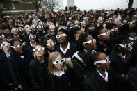 <p>School children wearing protective glasses pose for photographers outside The Royal Observatory during a partial solar eclipse in Greenwich, south east London, March 20, 2015. (Photo: Stefan Wermuth/Reuters) </p>