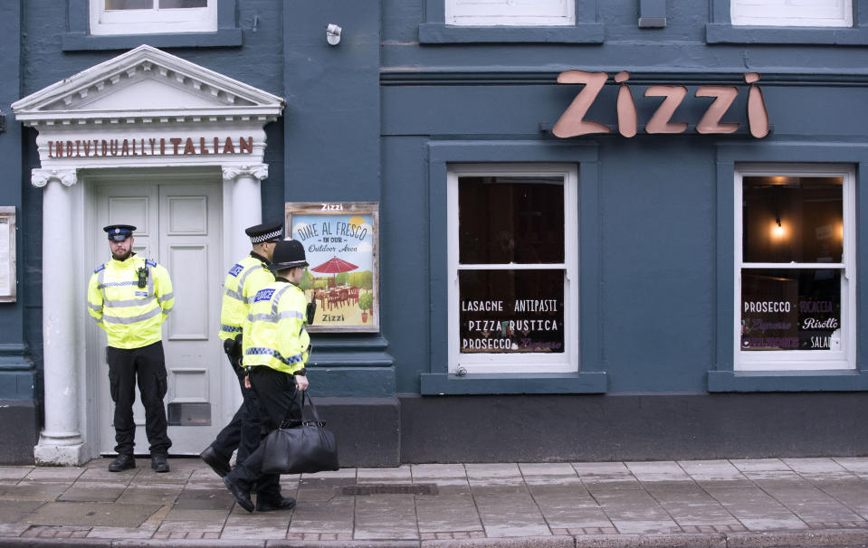 Police stand guard outside the Zizzi restaurant on Tuesday (Picture: PA)