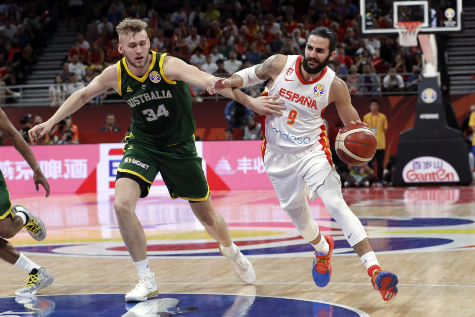 Ricky Rubio of Spain, right, drives past Jock Landale of Australia during their semifinal match in the FIBA Basketball World Cup at the Cadillac Arena in Beijing, Friday, Sept. 13, 2019. (AP Photo/Mark Schiefelbein)