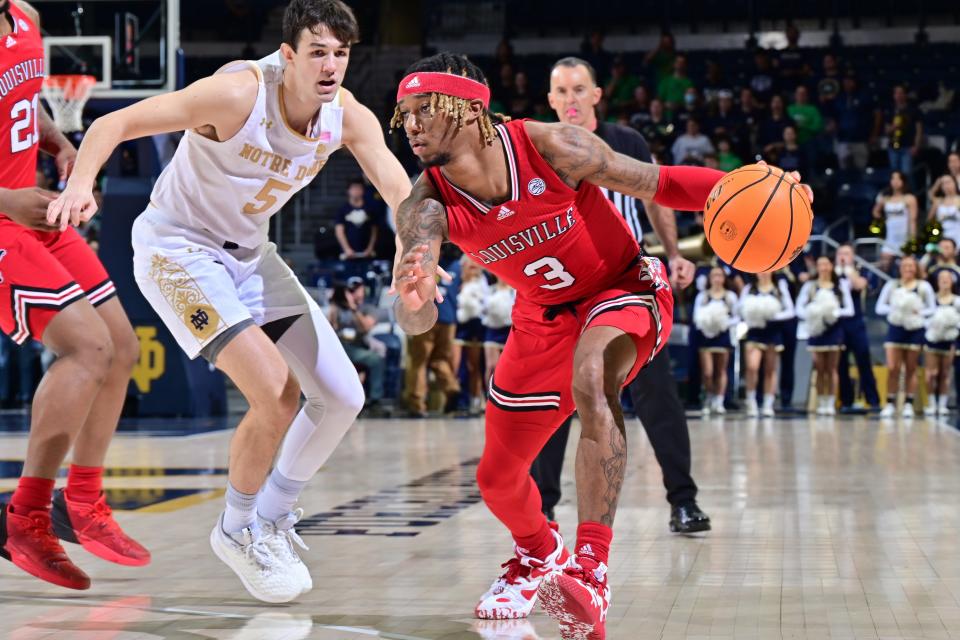 Louisville Cardinals guard El Ellis (3) dribbles the ball against Notre Dame Fighting Irish guard Cormac Ryan (5) in a game at Notre Dame.