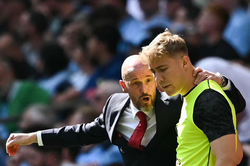 Manchester United's Dutch manager Erik ten Hag (L) speaks to Manchester United's Danish striker #11 Rasmus Hojlund  during the English FA Cup final football match between Manchester City and Manchester United at Wembley stadium, in London, on May 25, 2024.