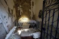 Damaged family chapels are seen in a cemetery following an earthquake at Sant' Angelo near Amatrice, central Italy, August 26, 2016. REUTERS/Max Rossi