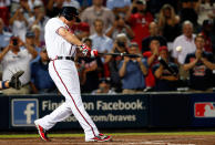 Chipper Jones #10 of the Atlanta Braves breaks his bat as he hits an infield single to extend the game in the ninth inning against the St. Louis Cardinals during the National League Wild Card playoff game at Turner Field on October 5, 2012 in Atlanta, Georgia. The Cardinals won 6-3 to advance to the National League Division Series. (Photo by Kevin C. Cox/Getty Images)