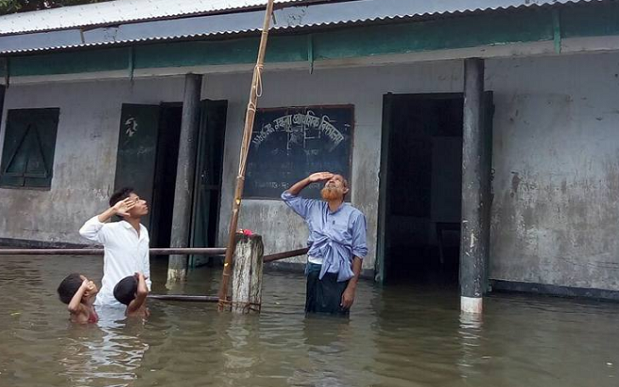 Children stand in floodwater to celebrate India's Independence Day - Facebook / Mizanur Rahman