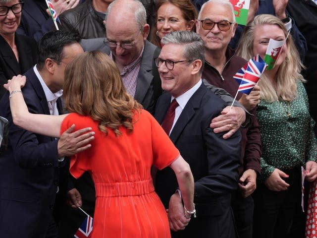 Sir Keir Starmer and his wife Lady Starmer greet the crowds