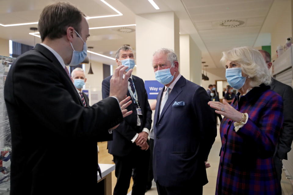 BIRMINGHAM, ENGLAND - FEBRUARY 17: Prince Charles, Prince of Wales and Camilla, Duchess of Cornwall talk with Health Secretary Matt Hancock during a visit to The Queen Elizabeth Hospital on February 17, 2021 in Birmingham, England. (Photo by Molly Darlington - WPA Pool/Getty Images)