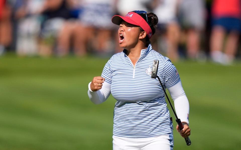 Megan Khang celebrates making her putt