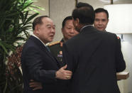 Thailand's Deputy Prime Minister and Defense Minister General Prawit Wongsuwon, left, attends a breakfast session with defense ministers at the 12th ASEAN Defence Ministers' Meeting in Singapore on Friday, Oct. 19, 2018. (AP Photo/Don Wong)